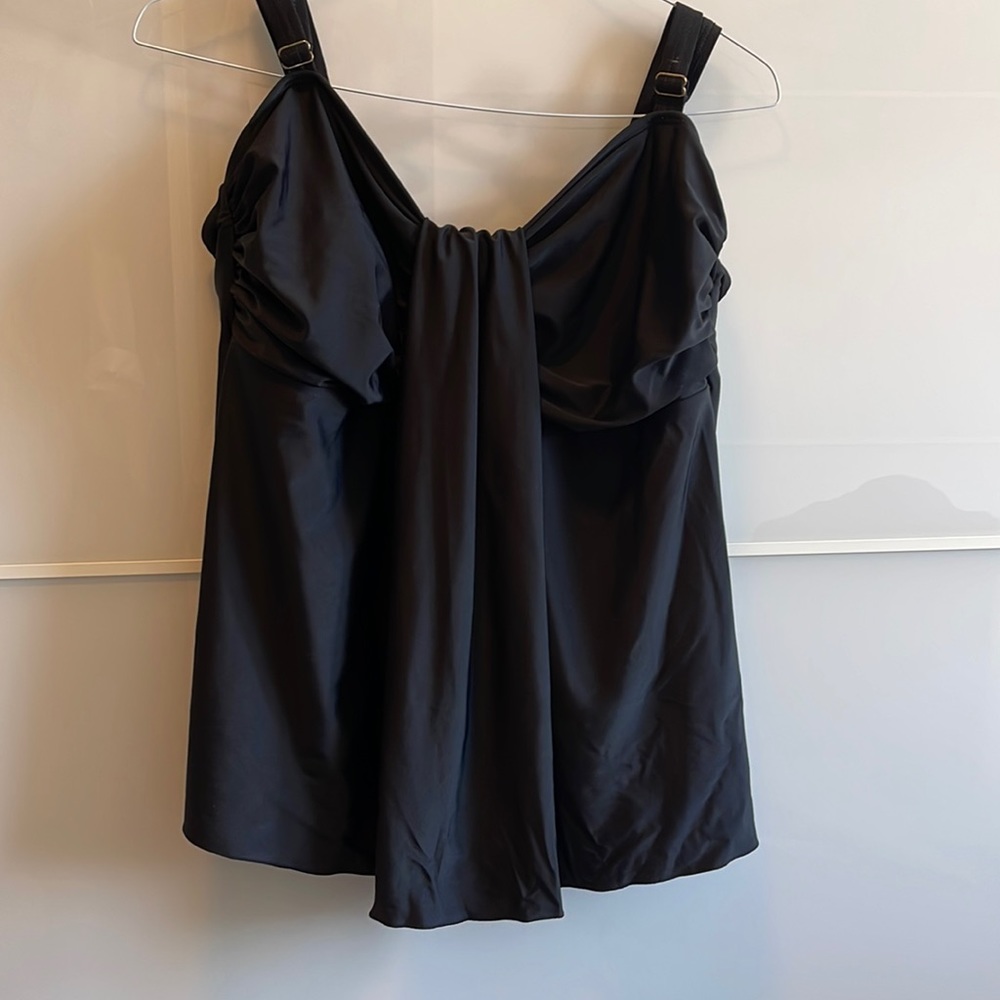 Black swimsuit top. Never worn but no tags. Adjustable straps